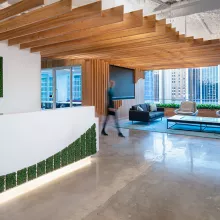 Office reception desk with ceiling wood panels