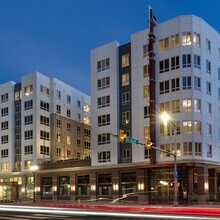 Exterior shot of an apartment building at night.