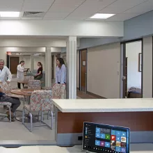 Patients and caregivers seated in common area