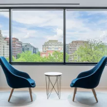 Two office chairs in front of a window