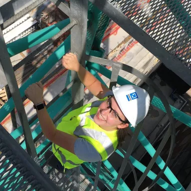 Intern climbing tower crane