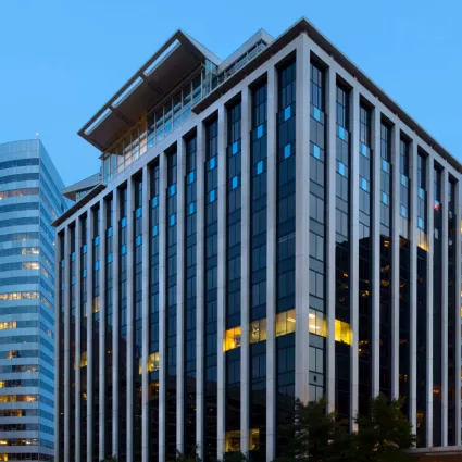 Exterior shot of an office building at night.