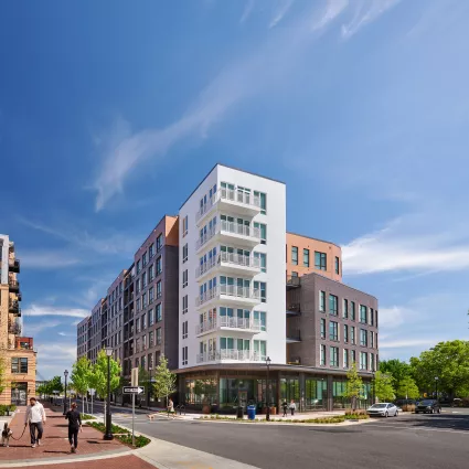 Exterior shot of an apartment building in the day.