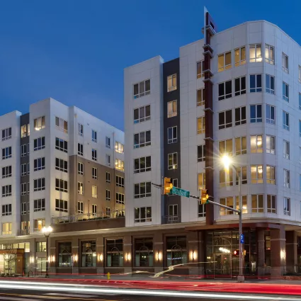 Exterior shot of an apartment building at night.