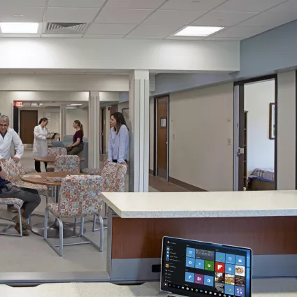 Patients and caregivers seated in common area