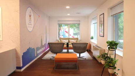 Interior view of room with two chairs facing window