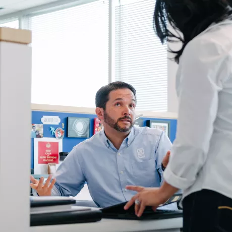 man sitting at desk