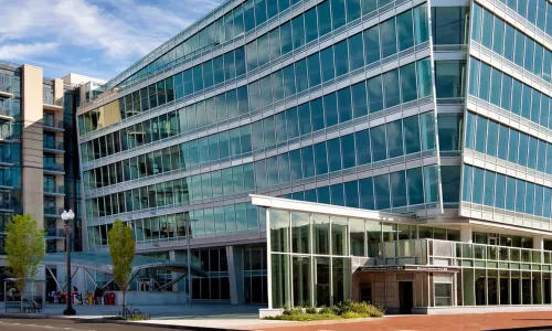 Corner of large office building with windows