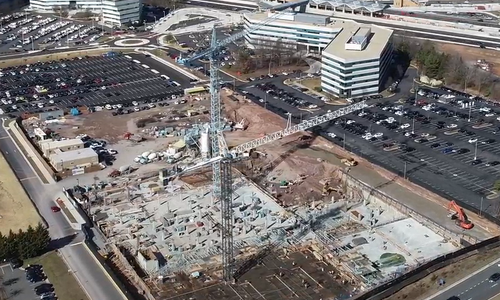 The beginning stages of an apartment project, including utilities and early infrastructure.