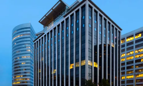 Exterior shot of an office building at night.