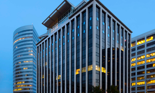 Exterior shot of an office building at night.