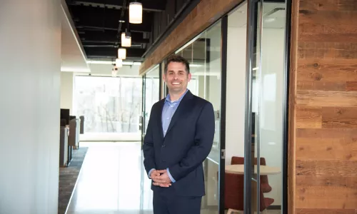 Man standing in office hallway