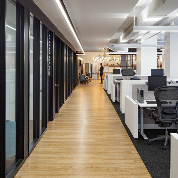 hallway with meeting space to the left and open work space to the right