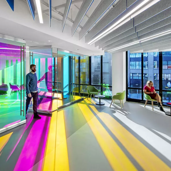 foyer area with sun casting colorful rays on the walls and floor