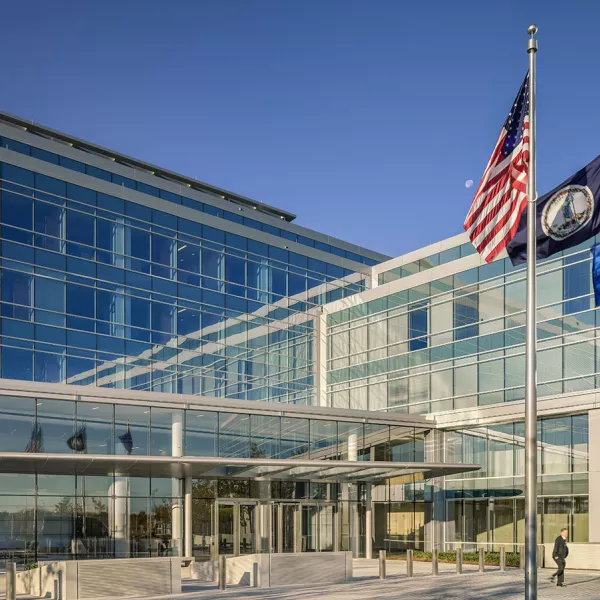 outside of building with flags in foreground