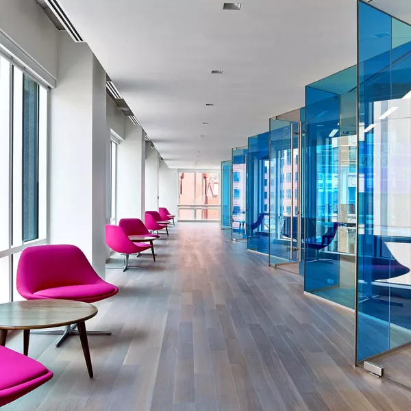 hallway with chairs to the left and office space to the right