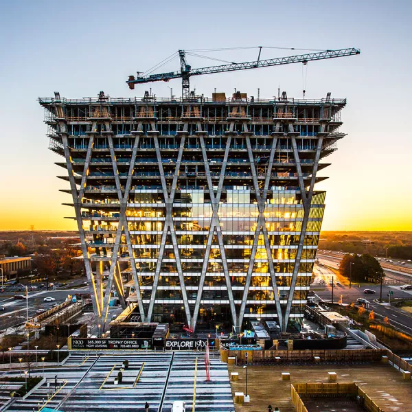 building under construction with crane on top