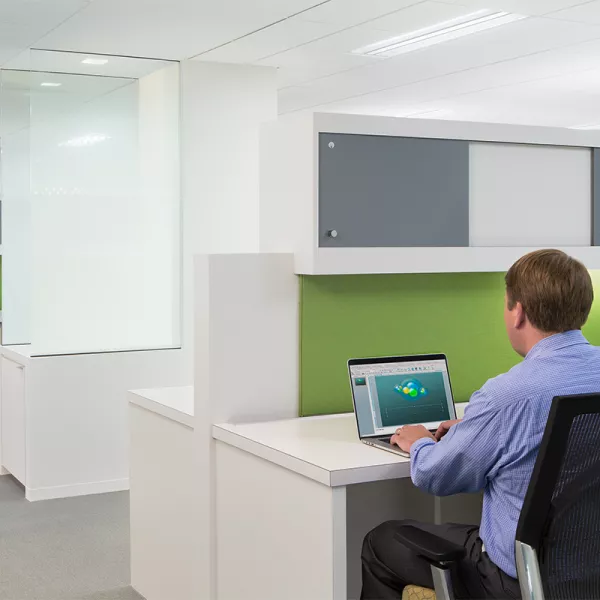 man at hospital workstation