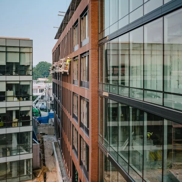 Exterior Shot of an Office Building, with glass facade and concrete.