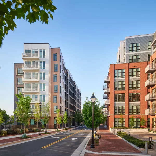 Exterior shot of an apartment building in the day.