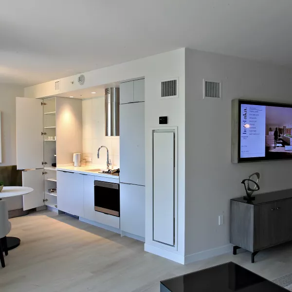 Luxury hotel room with kitchenette and small dining table