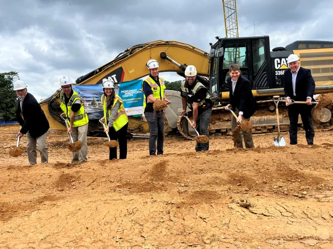 DAVIS team poses with shovels